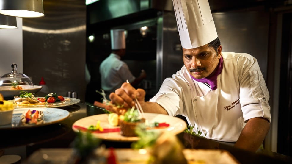 Shone Mathews, executive chef on  Ambassador's ship Ambience, at work. Credit: Joby Sessions